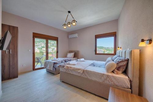 a large bedroom with two beds and a window at Apart Hotel XXL Lux in Dobra Voda