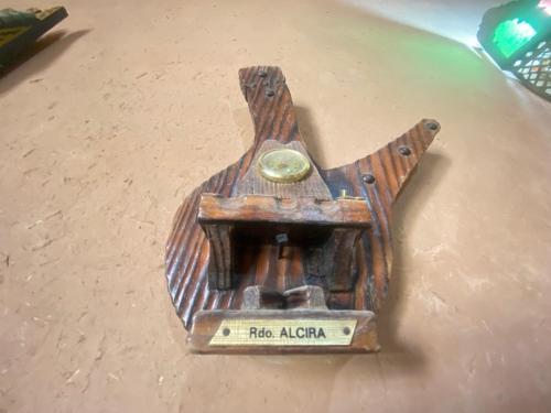 a wooden object with a clock on a table at Riad Dar Barbara in Ouarzazate