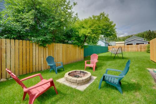 a group of chairs sitting around a fire pit in a yard at Red Lodge Retreat with Hot Tub 3 Blocks to Downtown in Red Lodge