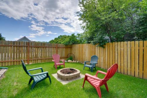 a group of chairs sitting around a fire pit in a yard at Red Lodge Retreat with Hot Tub 3 Blocks to Downtown in Red Lodge