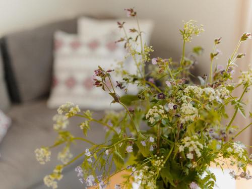 a bouquet of flowers in a vase on a table at Wideta in Smerek