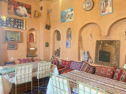 a living room with a couch and a table at Riad Dar Barbara in Ouarzazate