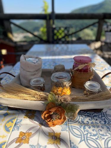 a tray with jars of honey and cookies on a table at Agriturismo A casa di Anna in Pellezzano