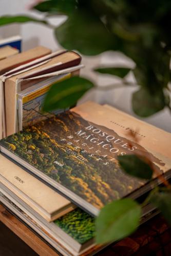 a stack of books sitting on a table at Vistas del Conde in Heredia