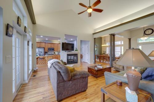 a living room with a couch and a table at Classy Home with Hot Tub and Mt Jefferson Views! in West Jefferson