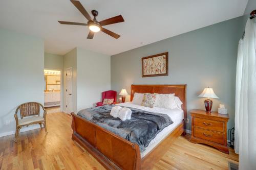 a bedroom with a bed and a ceiling fan at Classy Home with Hot Tub and Mt Jefferson Views! in West Jefferson