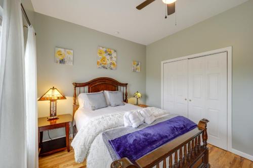a bedroom with a large bed with a wooden headboard at Classy Home with Hot Tub and Mt Jefferson Views! in West Jefferson