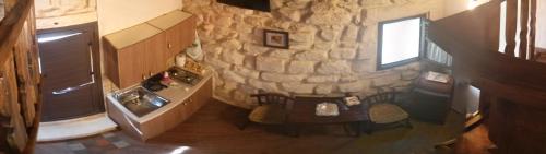 an overhead view of a kitchen with a stone wall at Anticu Dammusu in Scicli