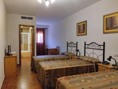 Postel nebo postele na pokoji v ubytování Hotel Condado de Miranda