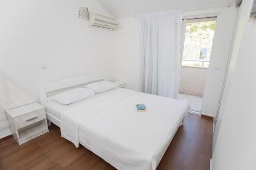 Postel nebo postele na pokoji v ubytování Apartment Petar