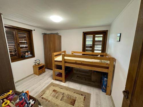 a bedroom with a bunk bed in a room at Cristian in Dejani