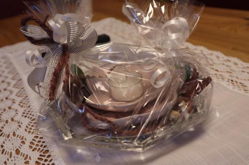 a clear plastic container filled with shells and other items at Landhaus-Appartements Warraich in Schladming