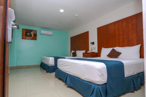 Кровать или кровати в номере Terracaribe Hotel Boutique