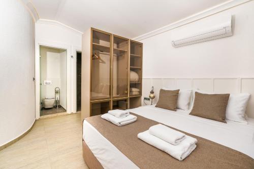 Postel nebo postele na pokoji v ubytování Likya Gardens Hotel