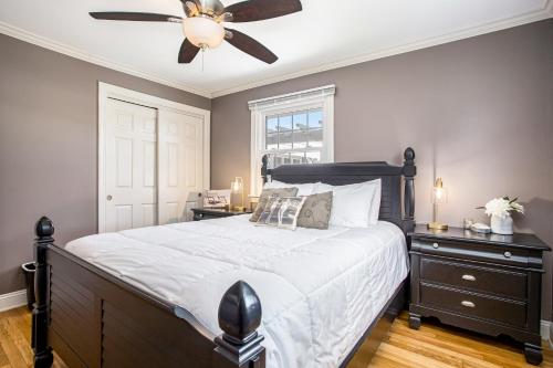 a bedroom with a bed and a ceiling fan at Surf's Up in New Buffalo