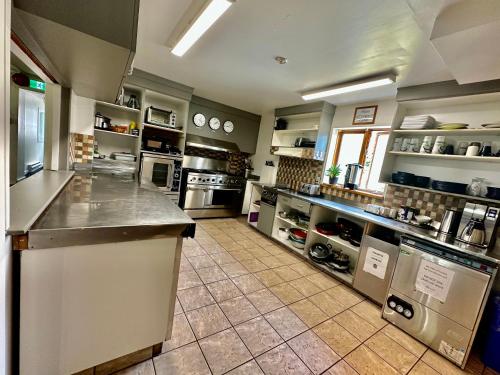 Kuchyň nebo kuchyňský kout v ubytování Auberge Manitonga