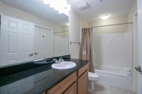 a bathroom with a sink and a toilet at Legacy I 102 in Gulfport