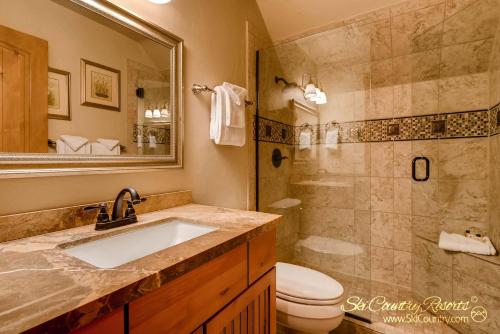 a bathroom with a sink and a shower and a toilet at True Downtown Location on Main St - 150 Steps to Gondola, Private Hot Tub, DOG FRIENDLY! SCC3 in Breckenridge