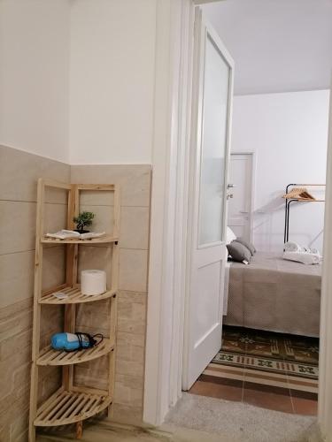 a room with a door leading to a bedroom at AREMU in Lecce