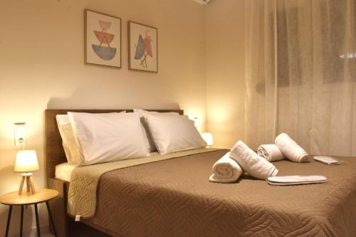 Katil atau katil-katil dalam bilik di Hospitium by the sea