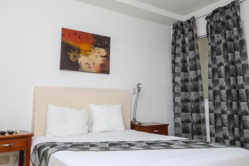 Кровать или кровати в номере Terracaribe Hotel Boutique