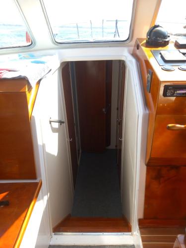 an open door in the middle of a small boat at Apartmani Čiklić in Dobropoljana