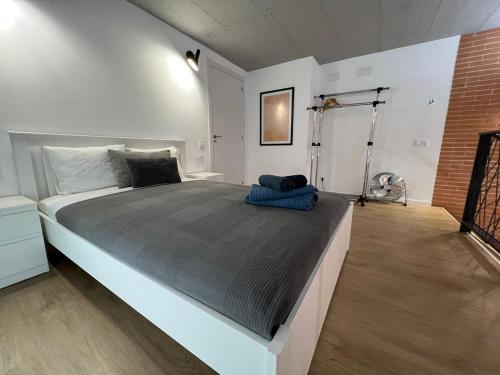 a bedroom with a large bed in a room at Carbonell 1 in Valencia