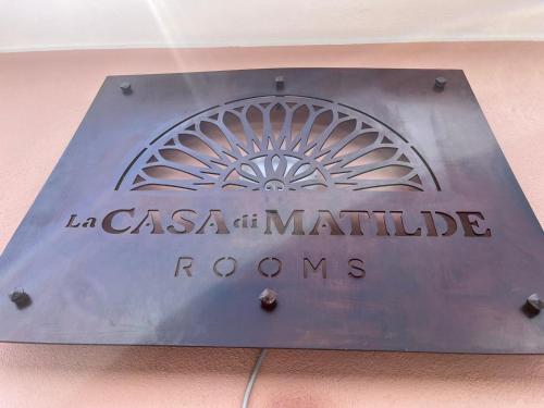 a metal sign that reads lasatal marriott rooms at La Casa di Matilde in Barcellona-Pozzo di Gotto