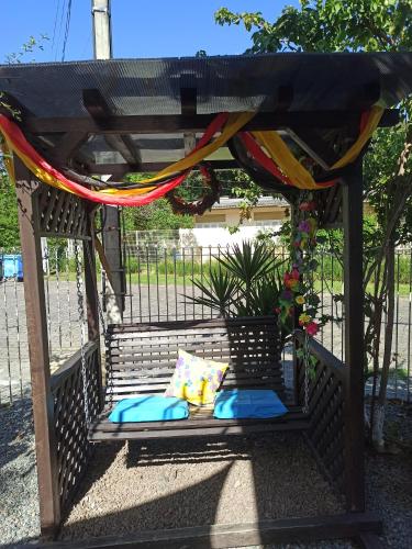 a gazebo with pillows and a hammock at Hostel Lumaria 1 in Blumenau