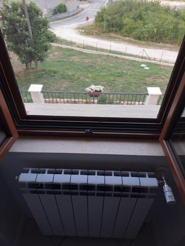 a window with a view of a street at Agriturismo Pavoni in Castelliri