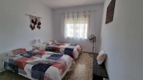 Ένα ή περισσότερα κρεβάτια σε δωμάτιο στο Apartamentos La Goleta 1