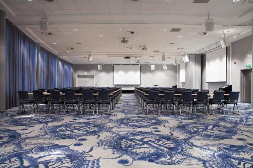 a conference room with chairs and tables in it at Quality Hotel Skjærgården in Langesund