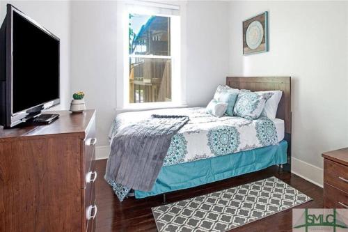 Ένα ή περισσότερα κρεβάτια σε δωμάτιο στο Design District Executive Rental Condo