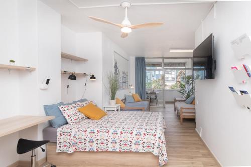 a bedroom with a bed and a living room at ABC - Apartment Beach & City + Balcony 6m2 in Las Palmas de Gran Canaria