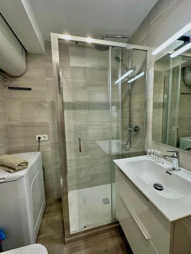 a bathroom with a shower and a sink and a toilet at Estudi Mar i Cel in Pas de la Casa