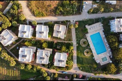 an overhead view of a group of houses and a pool at Antalya Manavgat in Manavgat