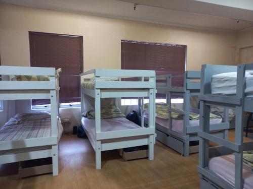 a room with four bunk beds in it at Home Away From Home in Cape Town