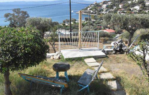 a playground with a swing and two chairs at MNS Marvelous Nirvana Seascape, Creativity in Perani
