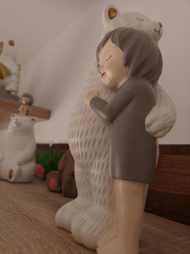 a figurine of a girl with a cat on her back at Serres Kavafi 7 city center , FREE PARKING in Serres