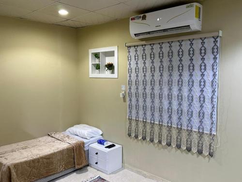 a hospital room with a bed and a heater at غرف الهدايه 