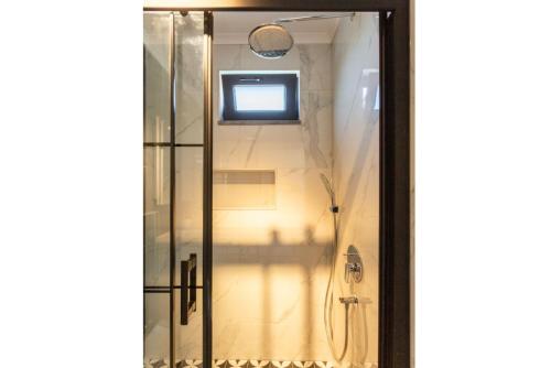 a glass door with a shower in a bathroom at Villa Exclusive Paradise 1 in Dalyan