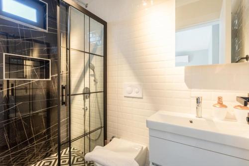 a bathroom with a shower and a toilet and a sink at Villa Exclusive Paradise 1 in Dalyan