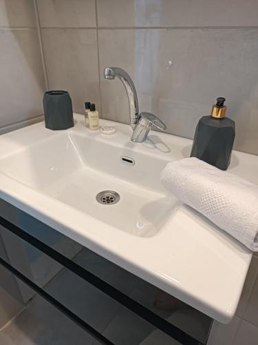 a white sink with a faucet in a bathroom at Ada suit in Kas