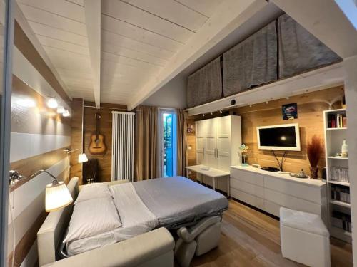 a bedroom with a large bed and a bathroom at La casa dei sogni in Falconara Marittima