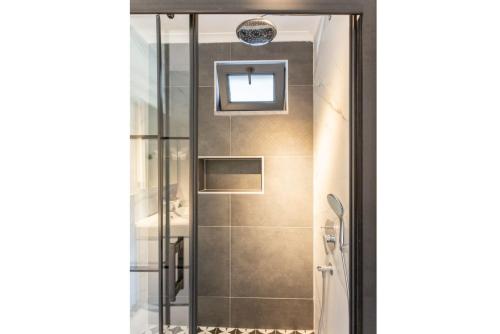 a shower with a glass door in a bathroom at Villa Exclusive Paradise 2 in Dalyan