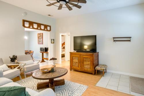 a living room with a couch and a tv at Pet-Friendly Darien Vacation Rental with Patio! in Darien