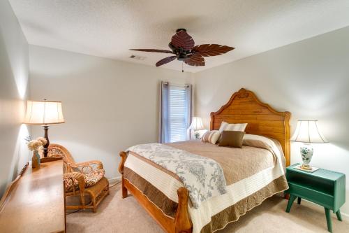 a bedroom with a bed and a ceiling fan at Pet-Friendly Darien Vacation Rental with Patio! in Darien