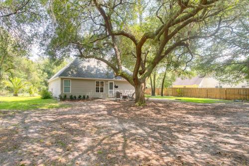 a large tree in front of a house at Pet-Friendly Darien Vacation Rental with Patio! in Darien