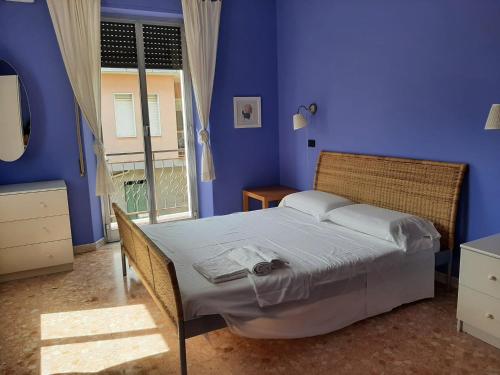 Posteľ alebo postele v izbe v ubytovaní Casa vacanze Omero 2