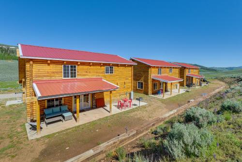 an overhead view of a row of log homes with red roofs at Mountain Cabin in Wyoming Range Scenic and Remote! in Kemmerer